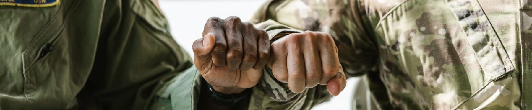 Soldiers fist bumping